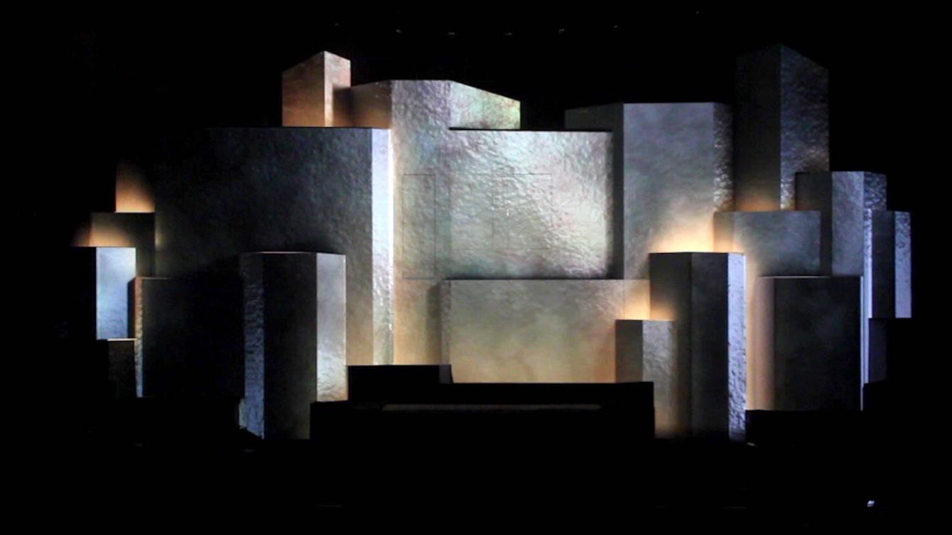 A stage of stacked projection-mapped cubes glowing blue during the Hannover Messe opening ceremony