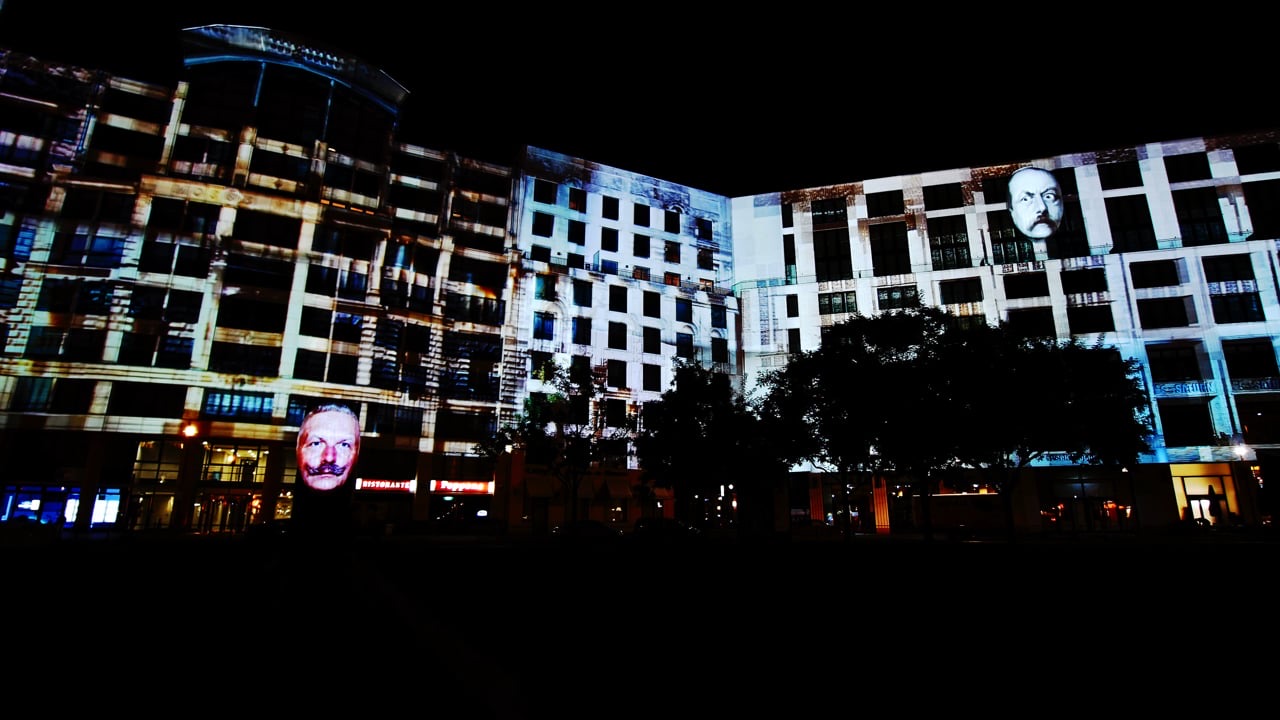 The long façade of the Mall of Berlin at Leipziger Platz covered by a large-scale 3D projection mapping at night