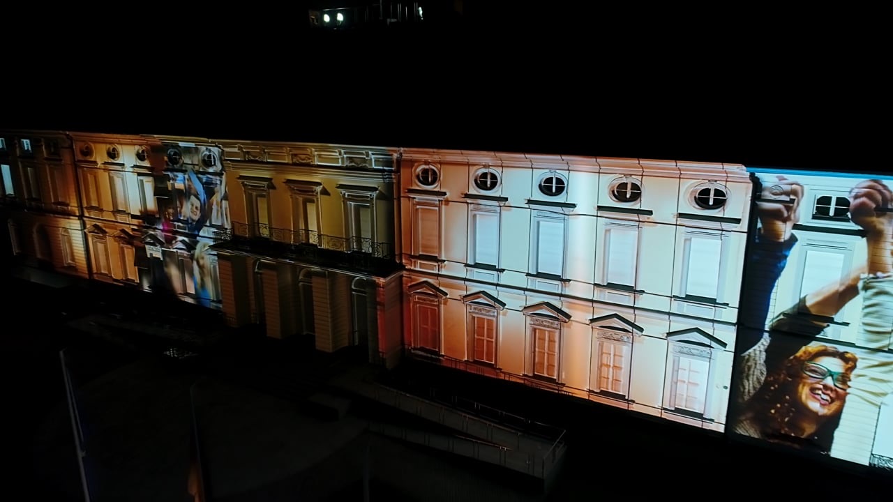 The façade of Schloss Bellevue in Berlin with a 3D projection mapping of colourful patterns during the Bürgerfest